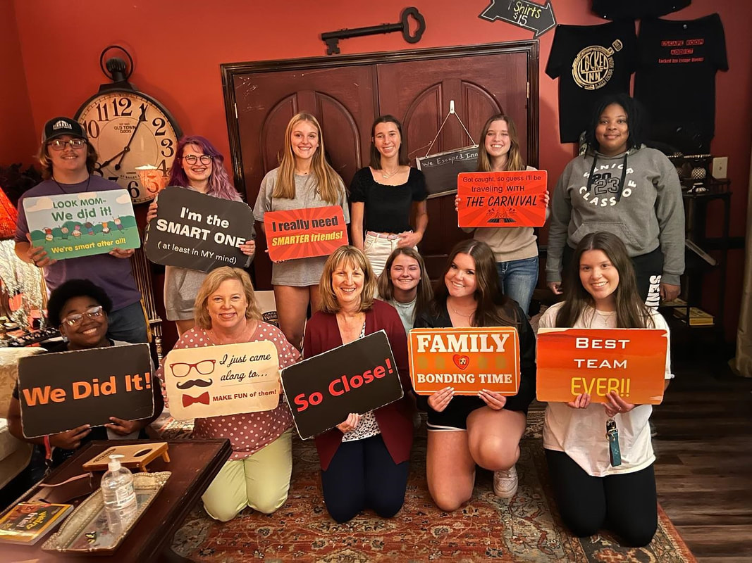 Francis Marion University First-Year Teaching Fellows posing for a group picture at Locked Inn Escape Room
